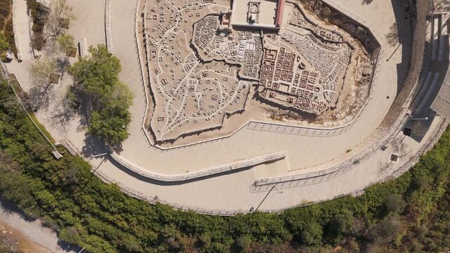 Aerial view of the Second Temple Model at The Israel Museum, featuring ancient stone structures and pathways surrounded by lush greenery in Jerusalem, Jerusalem District, Israel.