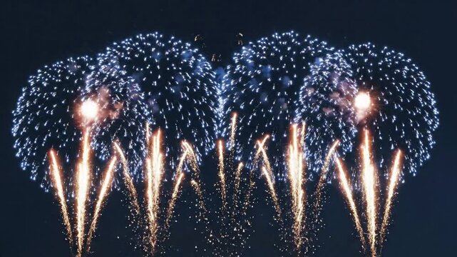 Blue and gold fireworks display bursting in night sky for new year celebration and holiday events pyrotechnics