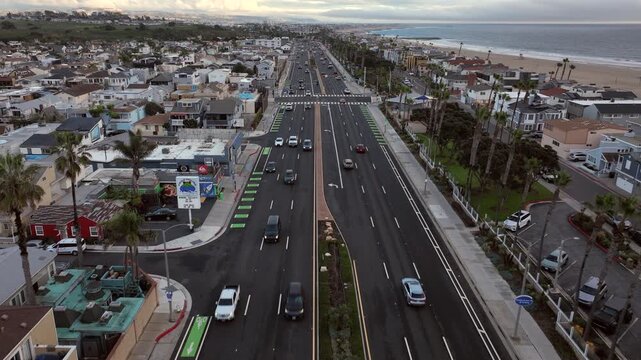 Newport Beach, California, USA - Aerial View Along Pacific Coast Highway Moving Toward Residential Neighborhood With Coastal Homes, City Streets and Orange County Landscape on a Rainy Overcast Day
