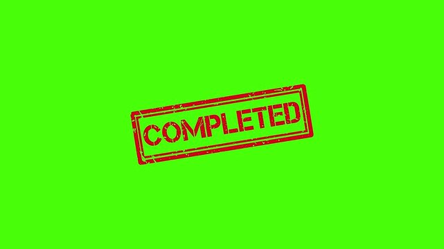Red rubber stamp impression with completed text on green screen background