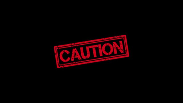 Red caution rubber stamp effect animation on black background, for warning and, safety alerts