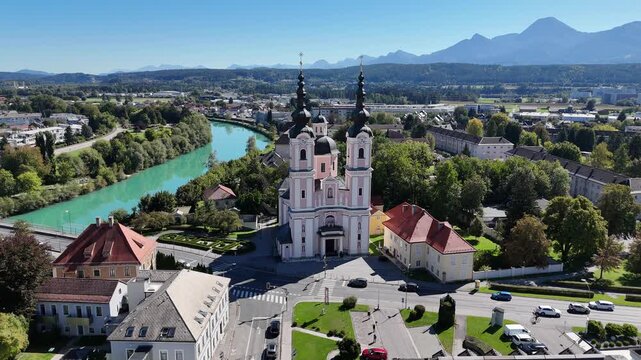 Cinematic Aerial View of Villach Austria &ndash; Historic Church, Alpine Town and Mountain Scenery