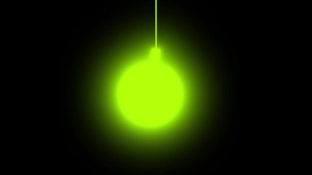 Swinging glowing green spherical light or Christmas bauble hanging on a dark background.