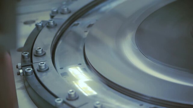 Industrial centrifuge separator drum spinning factory. Closeup steel machinery.