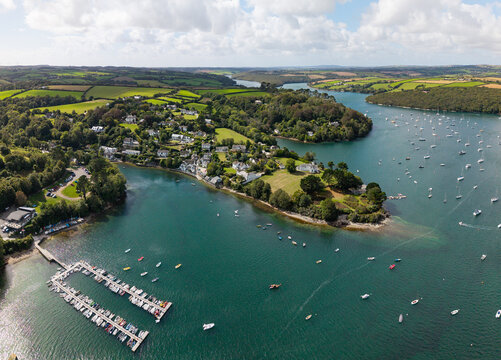Aerial panorama of Helford village in Cornwall, UK with marina and sailing boats