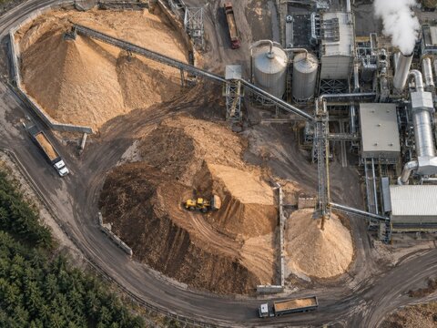 Aerial Industrial Plant with Large Woodchip Piles