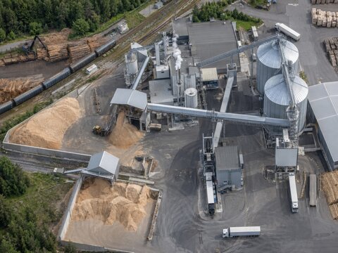 Aerial Sawmill Complex with Timber Stockpiles