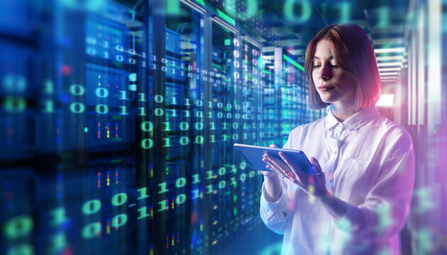 Data center, IT specialist uses a tablet to monitor server operations, manage digital information and control cloud computing infrastructure in a server room.