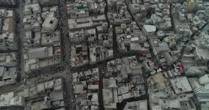 Aerial view of dense urban cityscape with narrow streets and rooftops in Karachi, Sindh, Pakistan.