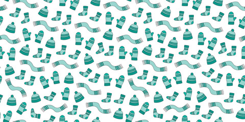 Fototapeta premium Set warm cozy knitted clothes. Seamless pattern featuring hats, scarves, socks, mittens. Bright knitted wool items. A vibrant repeating background, wallpaper, decor.