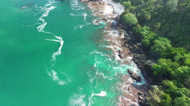 Aerial drone footage of Wedi Awu Banyu Anjlok beach coastline with turquoise water in Malang East Java