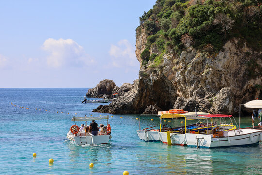 Tourist Excursion Boats in the Clear Turquoise Waters of Paleokastritsa Corfu Greece.