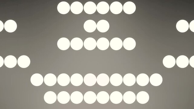 Loosely Scattered Cream Orbs Drifting Over a Charcoal Surface