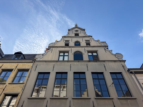 Antwerpen, Belgium, September 21, 2026 - Ornate Flemish gable facade of a historic townhouse against blue sky in Antwerpen, Belgi&euml;
