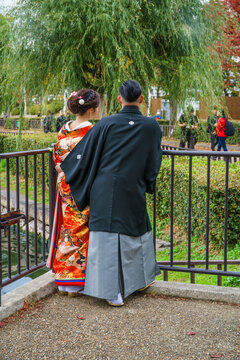 Asian couple wearing kimono posing in Osaka Park. Osaka. Japan