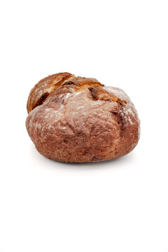 Rustic artisan loaf of crusty bread closeup on white background showing golden brown cracked crust and flour dusting surface grain