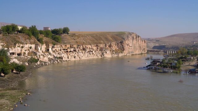 Hasankeyf, Turkey, limestone cliff with ancient rock-cut cave dwellings along the Tigris River, before the town was flooded by the Ilisu Dam