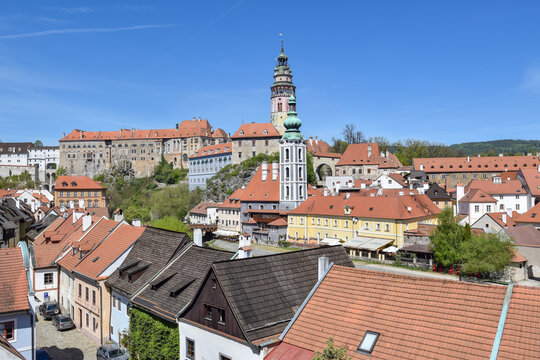 Panoramic view at historic town of Cesky Krumlov with Castle tower and St Jost church tower rising above surrounding buildings