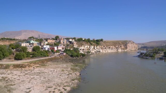 Hasankeyf, Turkey, village houses and cave-riddled cliffs on the Tigris River in Batman, before the flooding of the old town by the Ilisu Dam