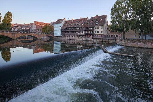 Historic timber-framed houses along the Pegnitz river in Nuremberg at golden hour light