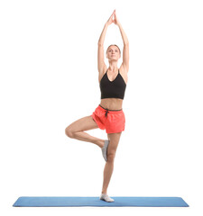 Young woman practicing yoga on fitness mat against white background