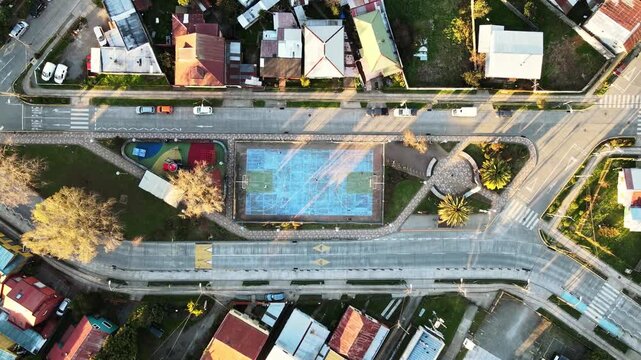 Top View of a Modern Residential Neighborhood with Roads, Houses and Green Spaces
