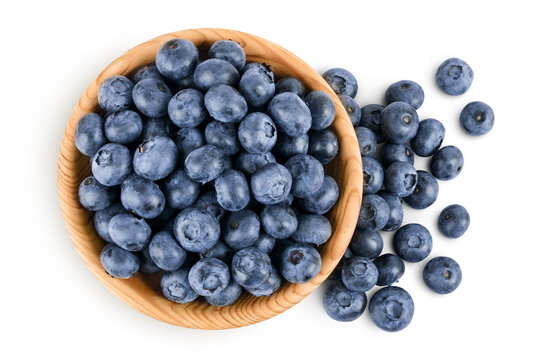 blueberry in wooden bowl isolated on white background. Top view. Flat lay