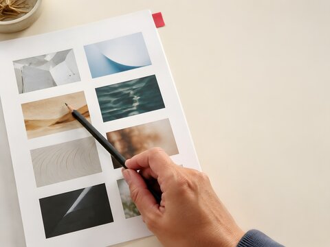 Reviewer sampling AI outputs from a contact sheet