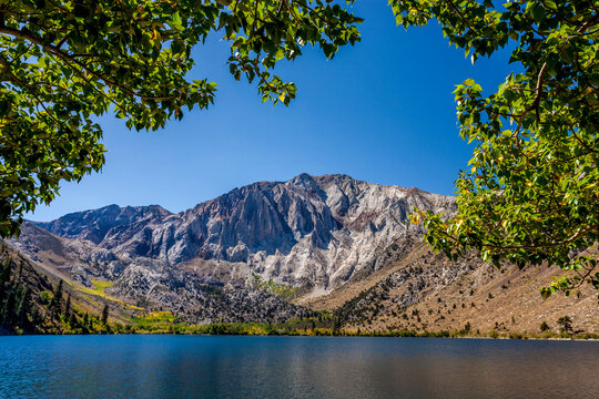 Convict Lake through trees on the shore in the Sierra Nevada mountains of California