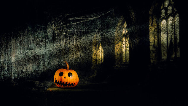 halloween pumpkin head jack lantern with burning candles, Spooky Forest with a full moon and wooden table, Pumpkins In Graveyard In The Spooky Night - Halloween Backdrop