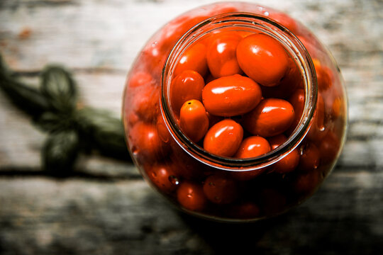 red and yellow cherry tomatoes in a jar for winter