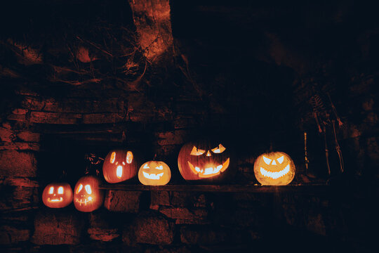 scary Halloween background with Jack'o'lanterns and skeleton