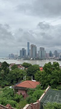 Xiamen skyline viewed from Gulangyu Island, China, with historic Bagua Mansion