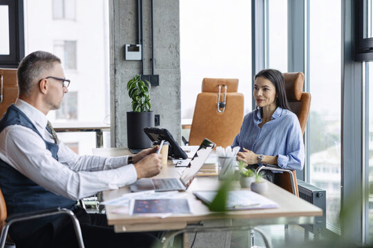 Cooperation and teamwork. Businesspeople discuss statistics and financial report. Office worker business colleague at office workplace for teamwork. Project planning. Business colleague in office