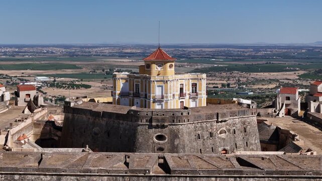 Elvas, Portugal - 10 September 2026: Aerial view of the historic Forte de Nossa Senhora da Graca, showcasing its star-shaped fortifications and central yellow building.