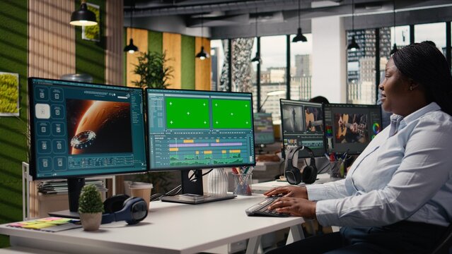 Mockup and AI generated video showing the planet Mars displayed on dual monitors, scene shows woman using PC with artificial intelligence tools and neural networks for extraterrestrial space visuals.