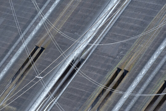 Crisscrossing power cables and spillway detail at Grand Coulee Dam