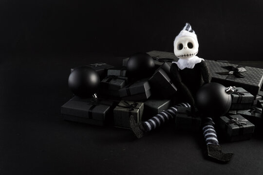 Skeleton elf sitting on dark christmas presents