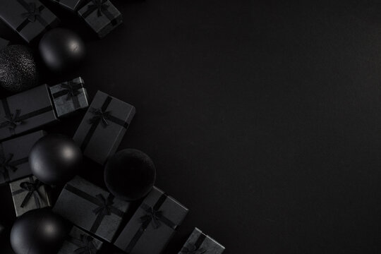 Black friday shopping with elegant black gift boxes and ornaments