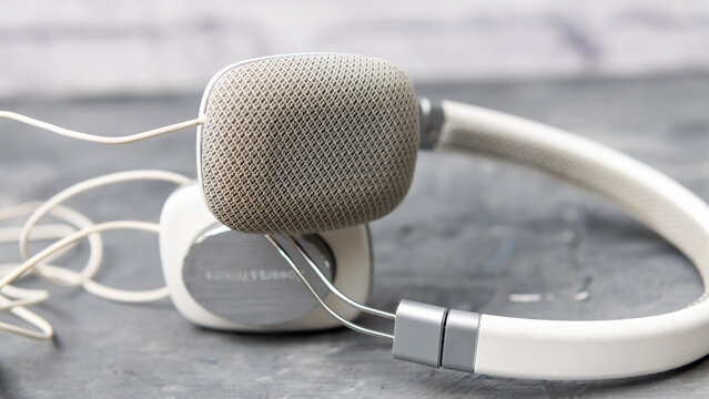 A fabric ear cushion fills this close view of Bowers & Wilkins P3 headphones.