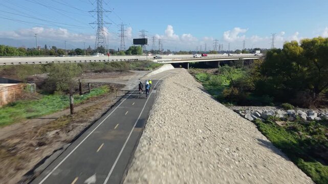 Cyclists on a river trail bike path