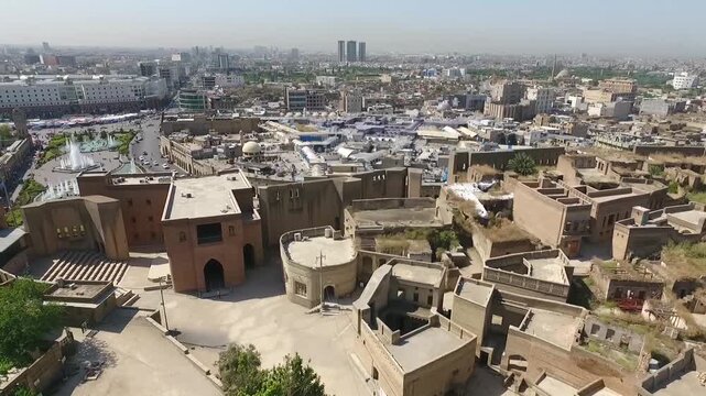 Drone rising over the south gate and old houses of the Erbil Citadel, Kurdistan