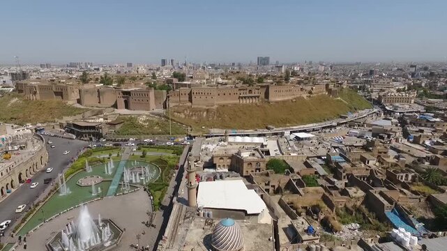 Aerial flight from Shar Park over the old city toward the Erbil Citadel mound, Kurdistan