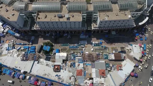 Top-down aerial view over rooftops of the old bazaar and market stalls in Erbil