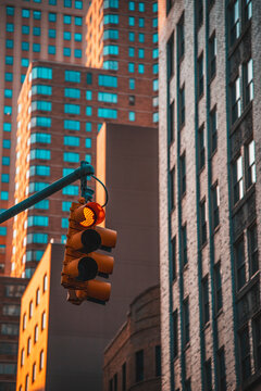 Traffic lights and tall buildings on West 49th Street Manhattan