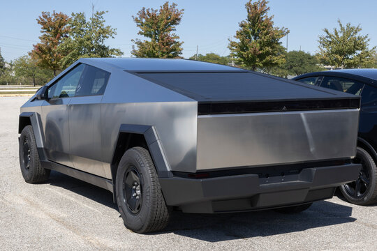 Tesla Cybertruck Electric Utility Truck display. Tesla offers the Cybertruck with up to 325 miles driving range. MY:2026