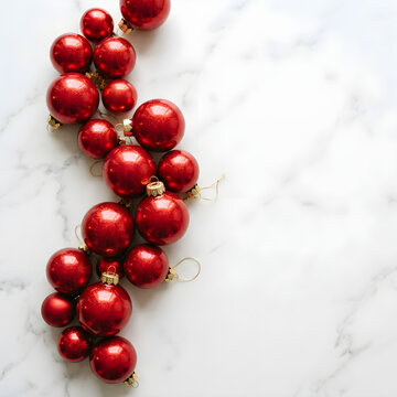 Festive Red Christmas Baubles Arranged on a White Marble Background
