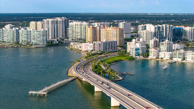 An aerial view of downtown Sarasota, FL and the Ringling Bridge (John Ringling Causeway) taken during the late afternoon on a hot summer weekend.