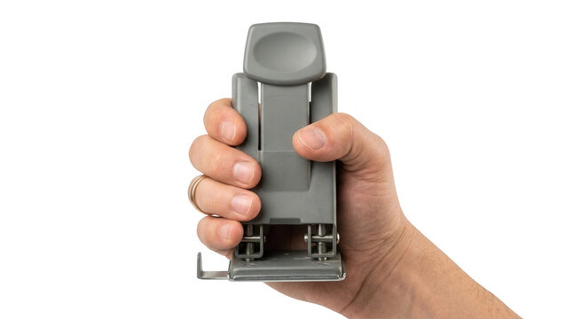 A close-up view of a person's hand gripping a modern, gray stapler, showcasing the sleek design and practical functionality in an office environment, set against a solid black background