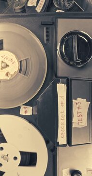 Vintage reel audio recorder and tape rolls. Audio reel player.